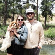 Seth Rogen and Laura Miller posing with dog Zelda