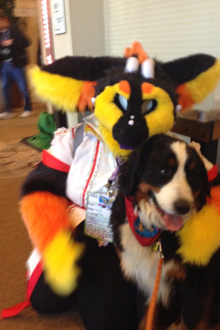 Woman brings her dog to a Furry Convention