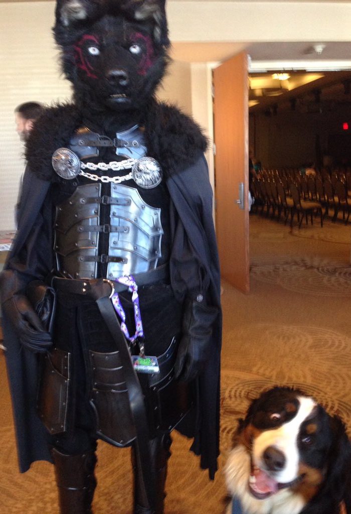 Woman brings her dog to a Furry Conventio