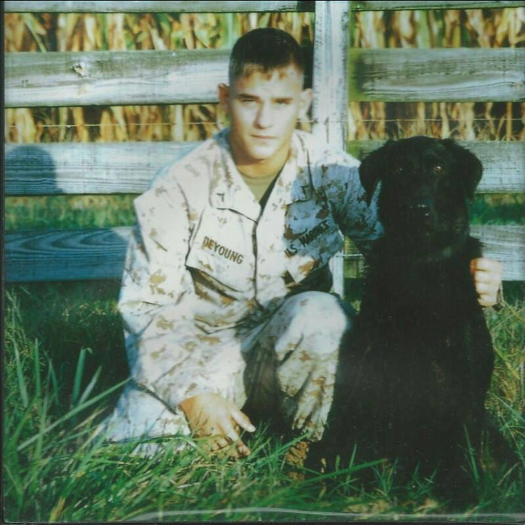 Marine Jeff DeYoung and Cena bomb sniffing dog
