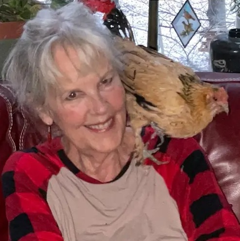 Owner Marsi and Peanut the world's oldest chicken