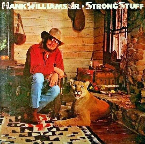 Hank Williams Jr with his pet mountain lion on the cover of his album Strong Stuff