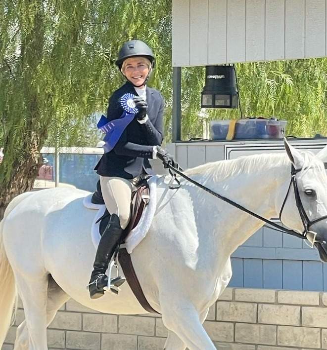 Selma Blair and her show horse Mr Nibbles winning a blue ribbon
