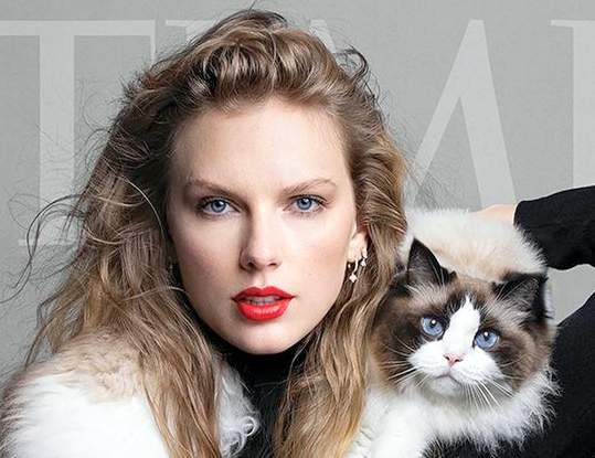 Close up of Taylor Swift and cat Benjamin Button in Time Magazine