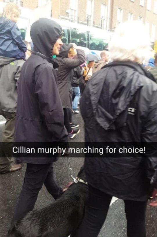 Cillian Murphy walking dog during a pro choice march in dublin