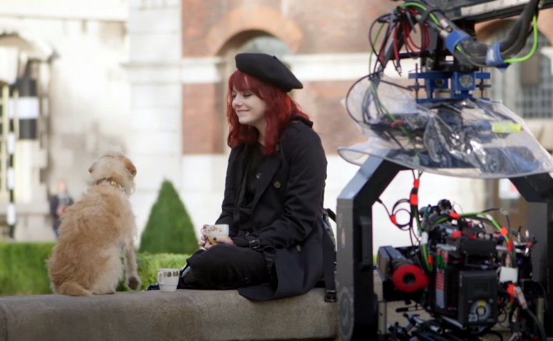 Behind the scenes of Cruella with Bobby the dog and Emma Stone