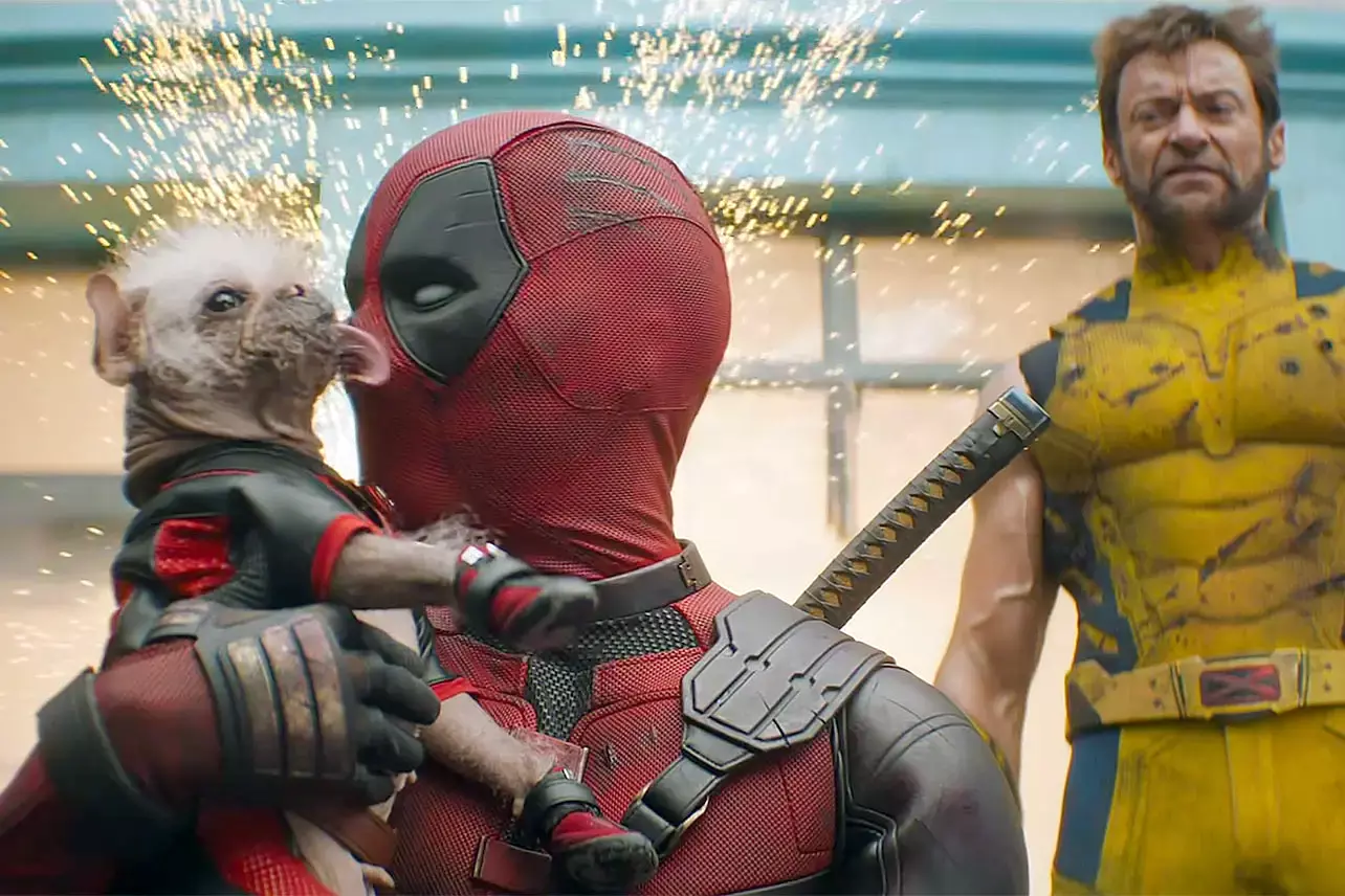 Deadpool and Dogpool kissing with Wolverine watching