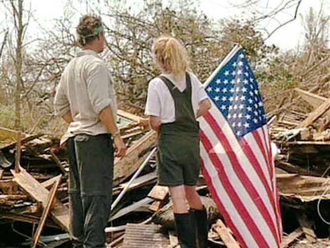 Matthew McConaughey with a survivor of Hurricane Katrina